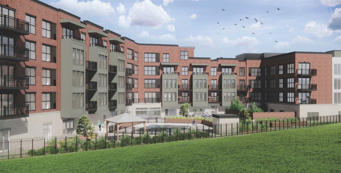 Exterior view of a senior living facility with gardens