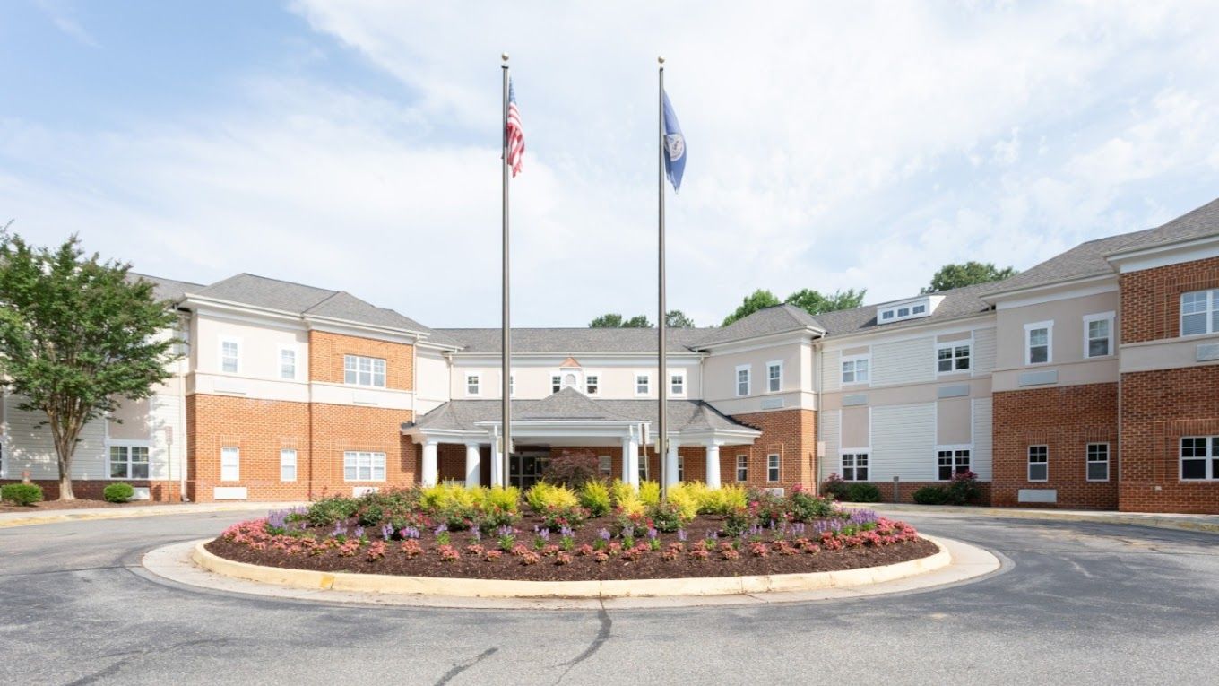 Exterior view of the Bellgrade Estates facility with flags.