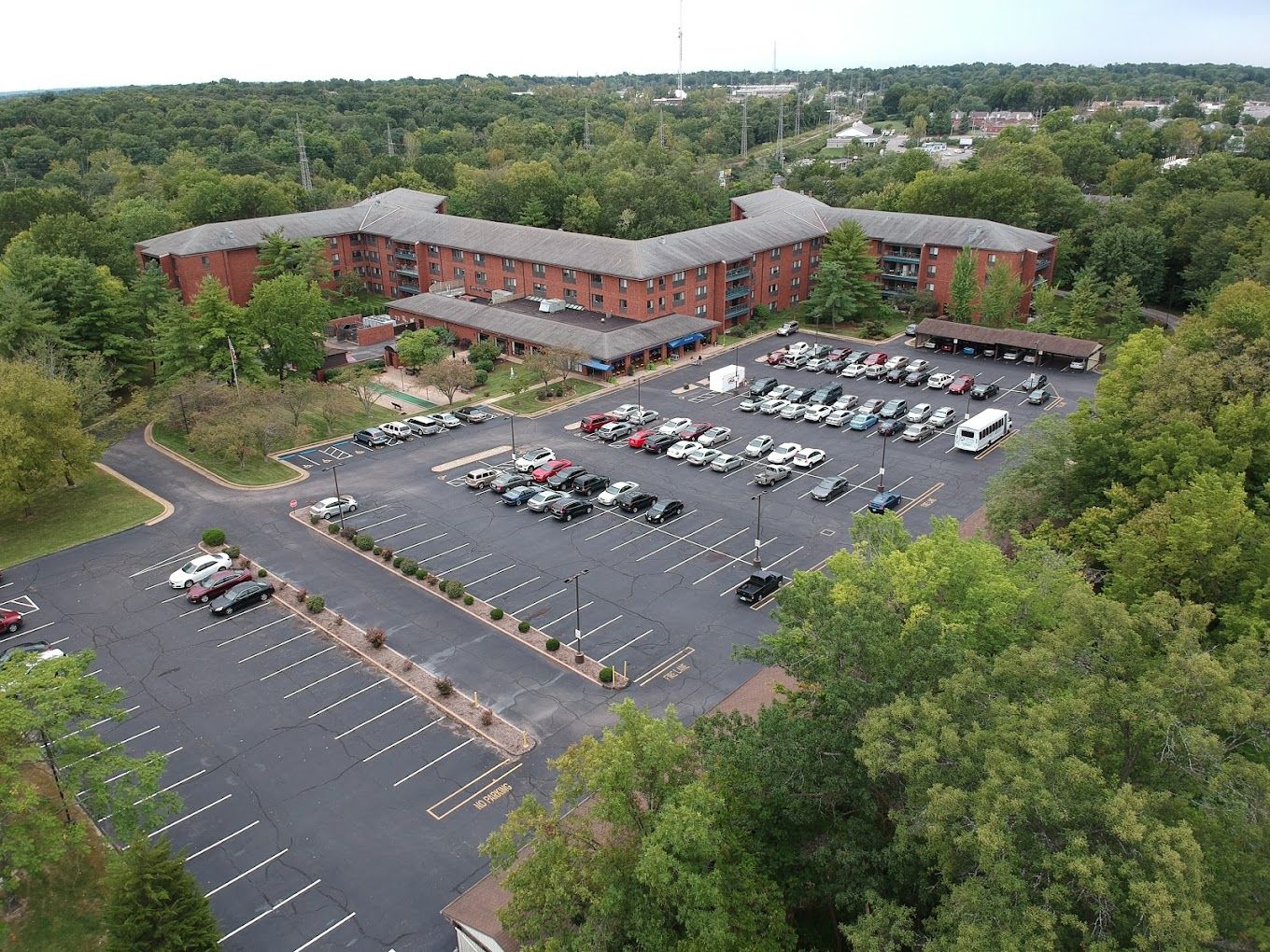 Aerial view of a senior living facility with parking lot
