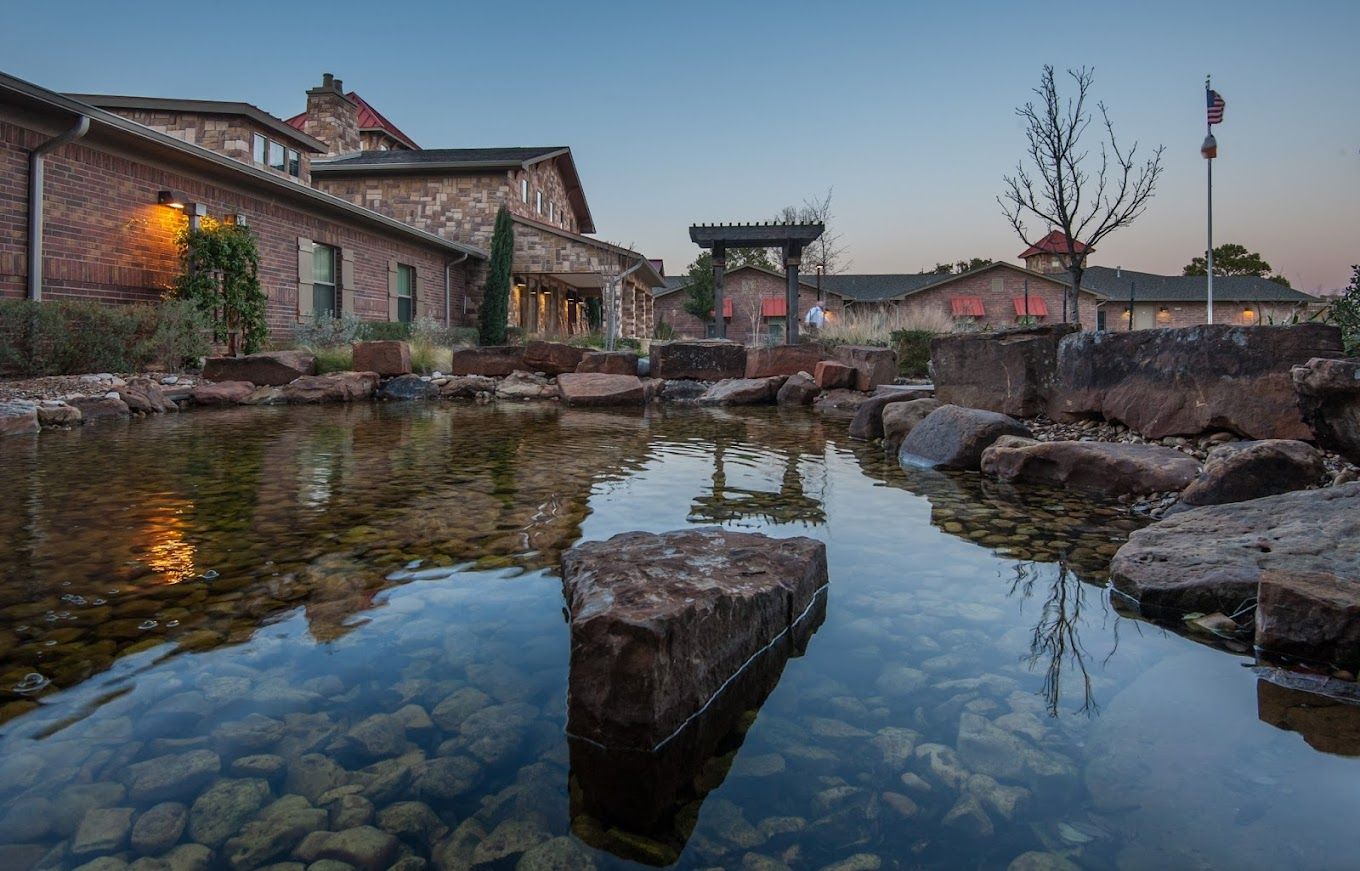 View of the facility's exterior and water feature