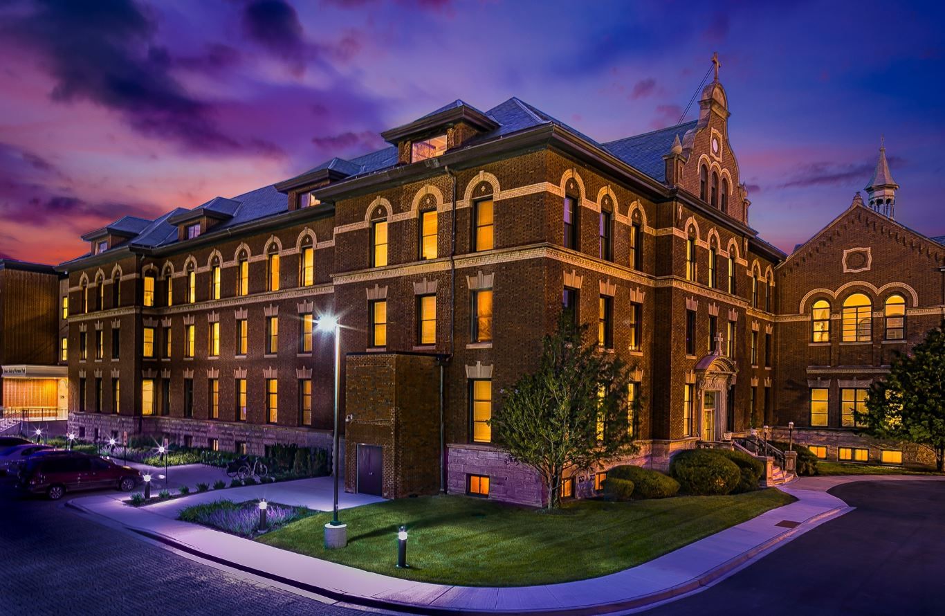 Exterior view of Senior Suites Chicago Norwood Park at dusk