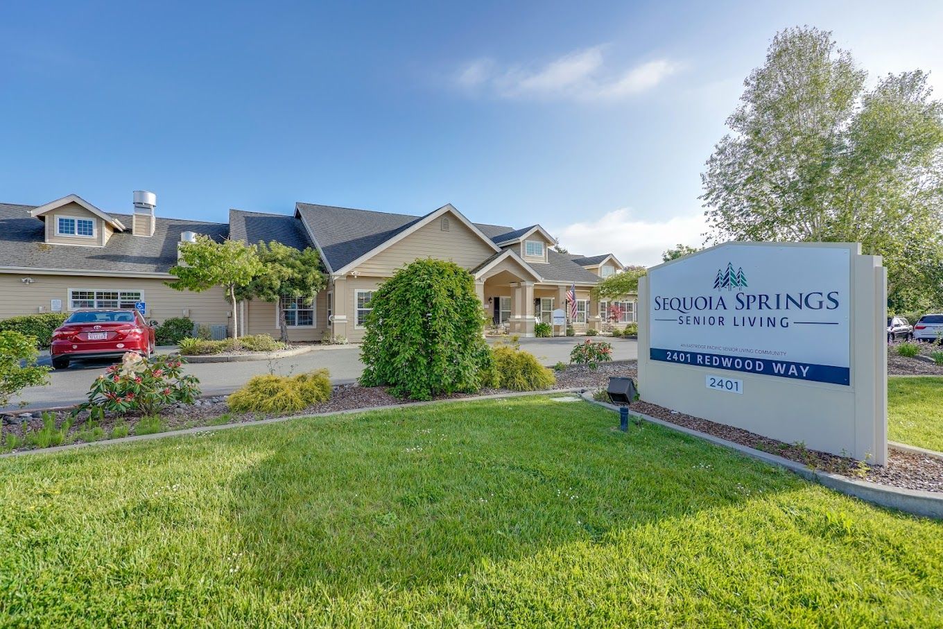 Exterior view of Sequoia Springs Senior Living with signage