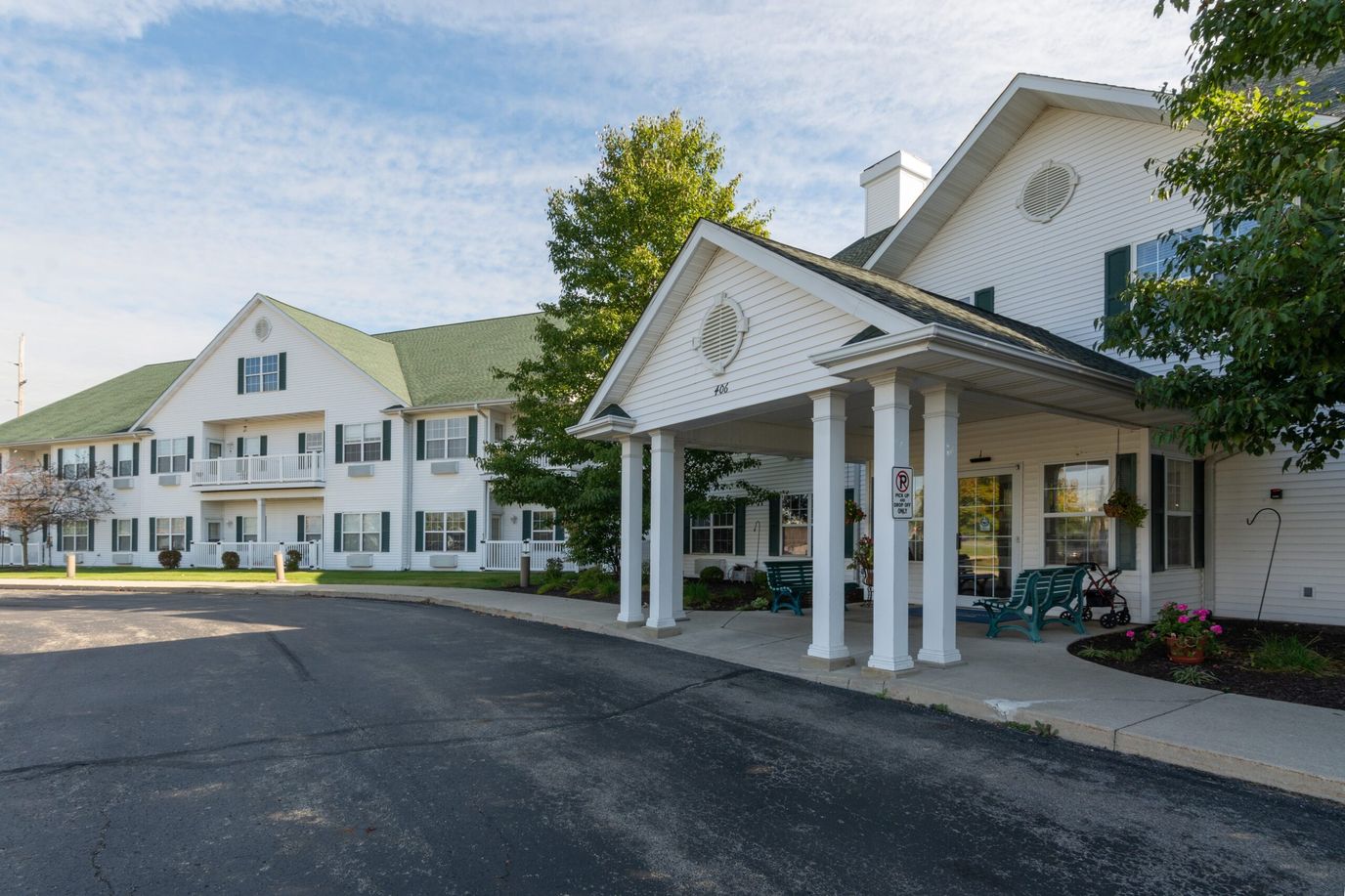 Front entrance of a nursing home with outdoor seating