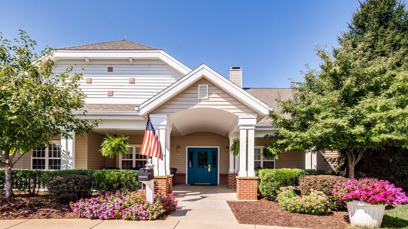 Exterior view of a senior living facility with a welcoming entrance