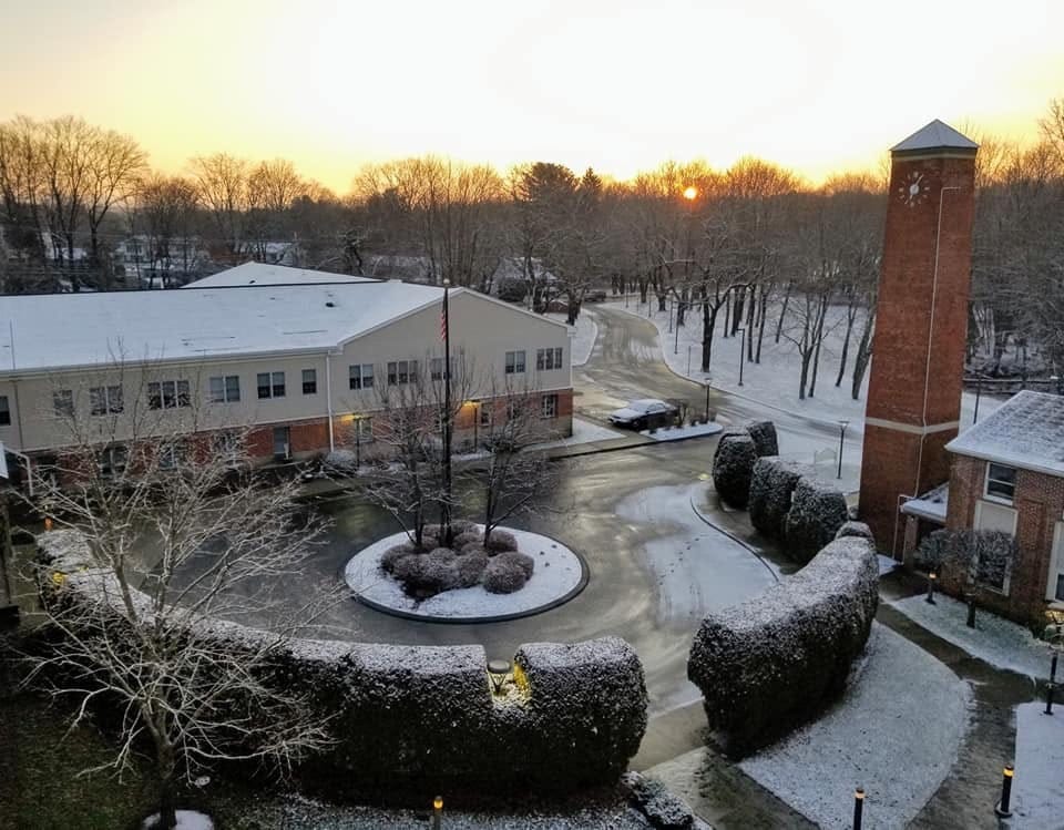 Exterior view of the assisted living facility at sunset