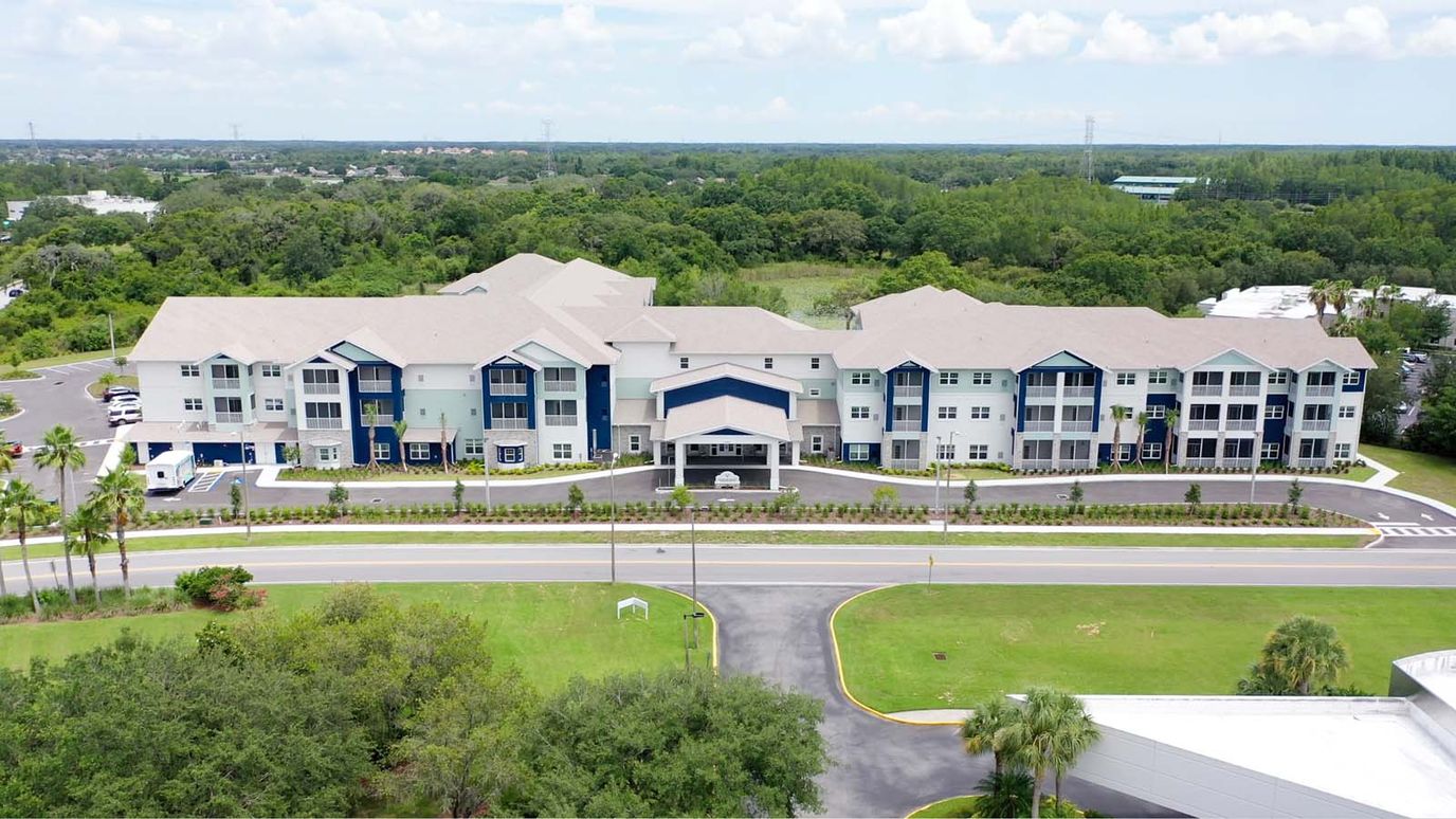 Aerial view of Sunflower Springs Trinity facility surrounded by greenery.