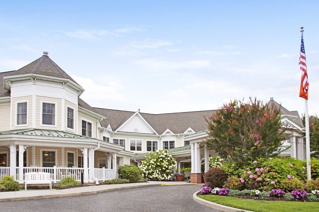 Exterior view of Sunrise of Dix Hills with landscaping