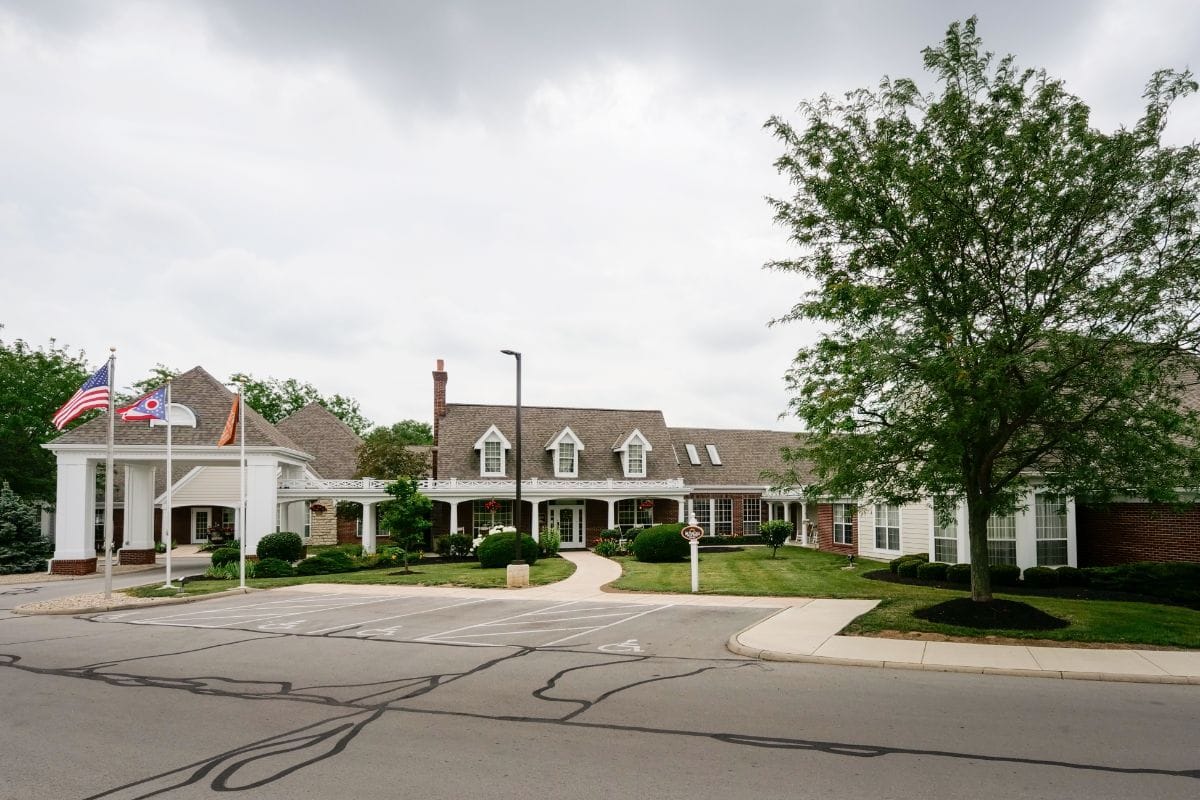 Exterior view of Sunrise of Findlay with flags