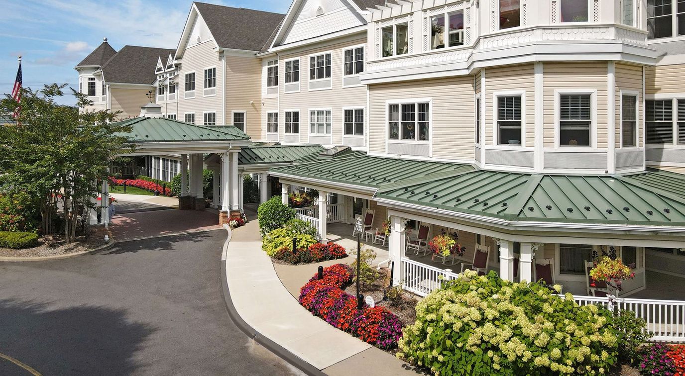 Exterior view of an assisted living facility with gardens