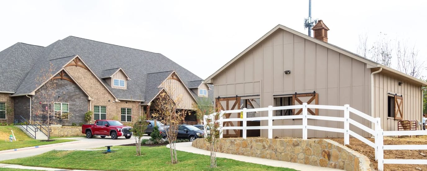 Exterior view of assisted living facility with buildings