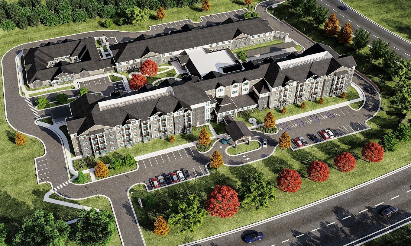 Aerial view of senior living facility with landscaped grounds