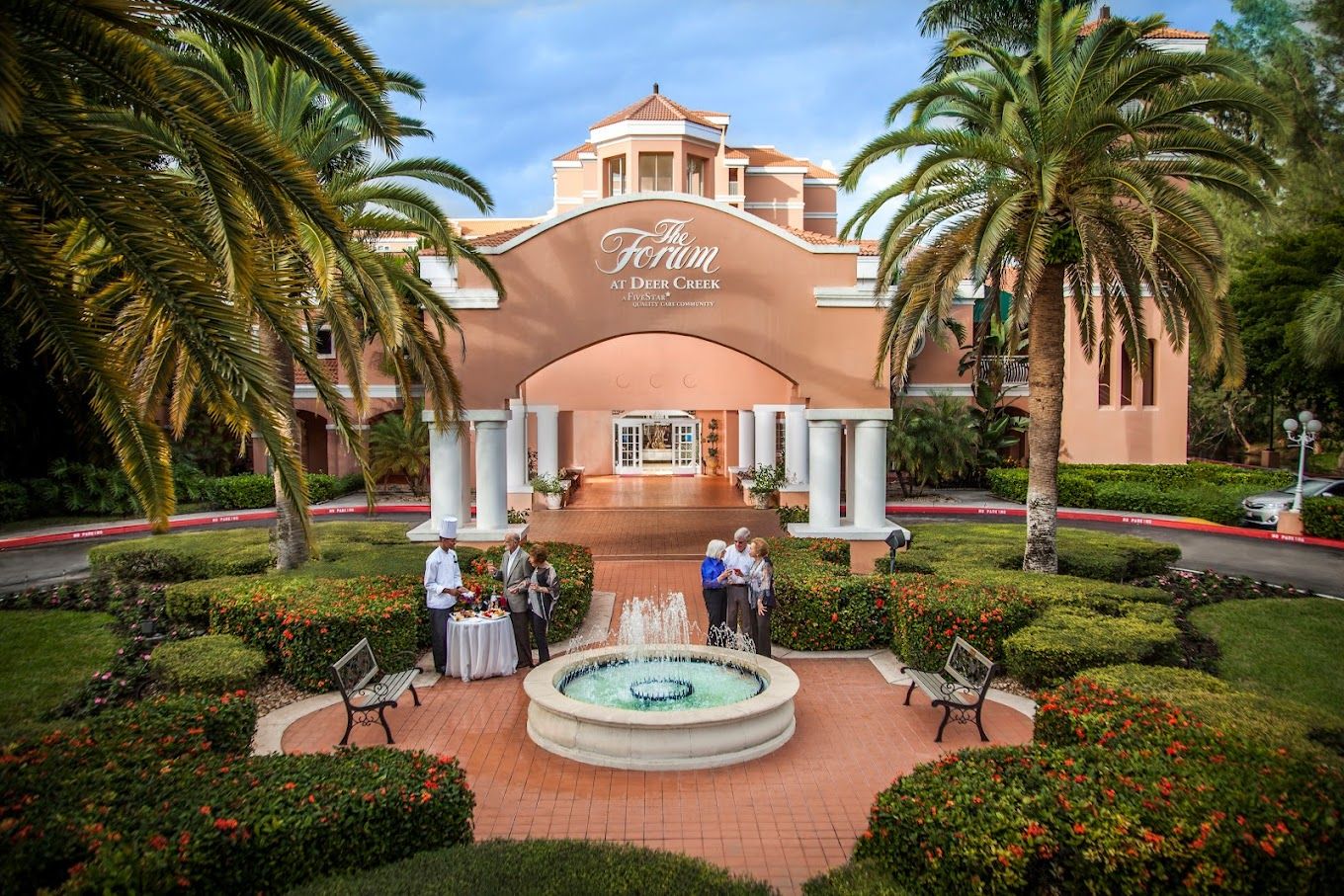 Exterior view of The Forum at Deer Creek with palm trees
