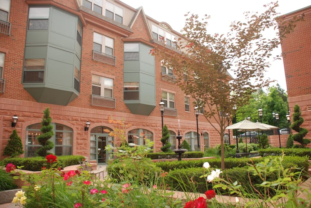 Outdoor garden area with the facility building in the background