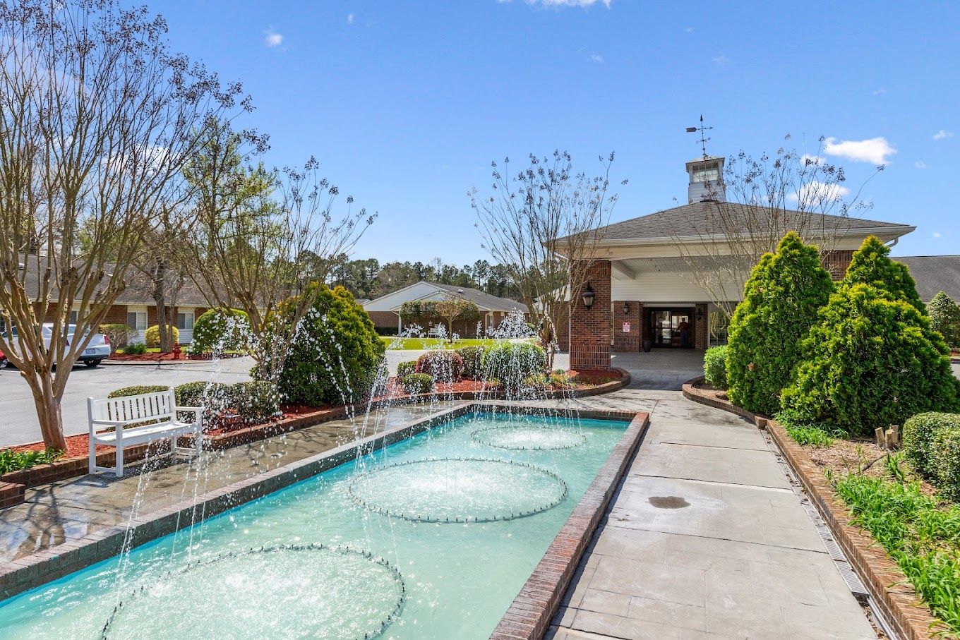 Exterior view with fountain and landscaped entrance