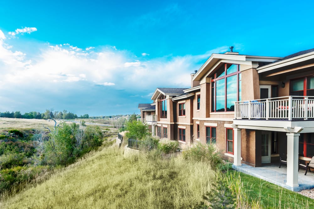 Exterior view of a senior living facility with garden space