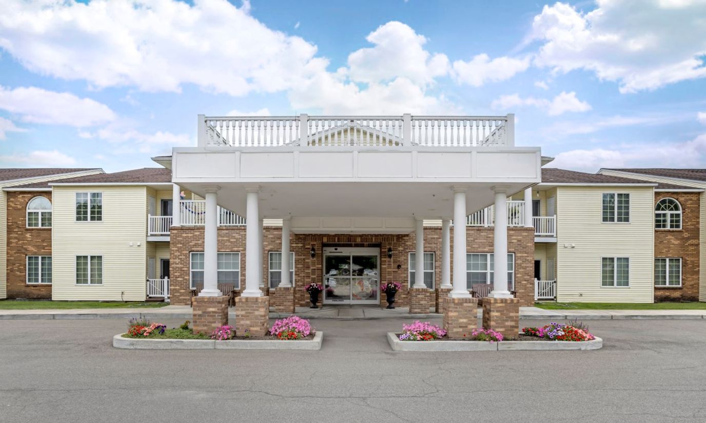 Front entrance of Brookdale Castle Gardens with flowers