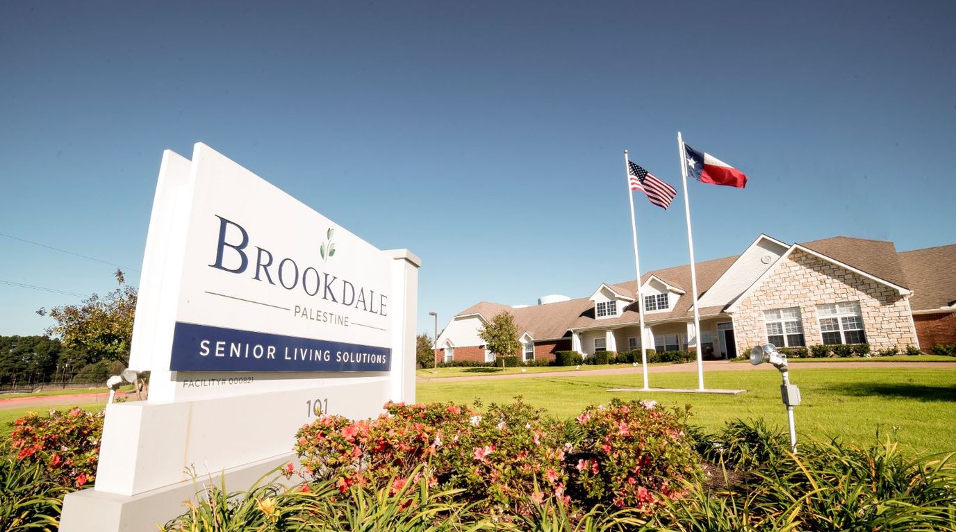 Exterior view of Brookdale Palestine facility with signage