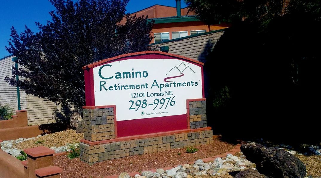 Sign for Camino Retirement Apartments in outdoor setting