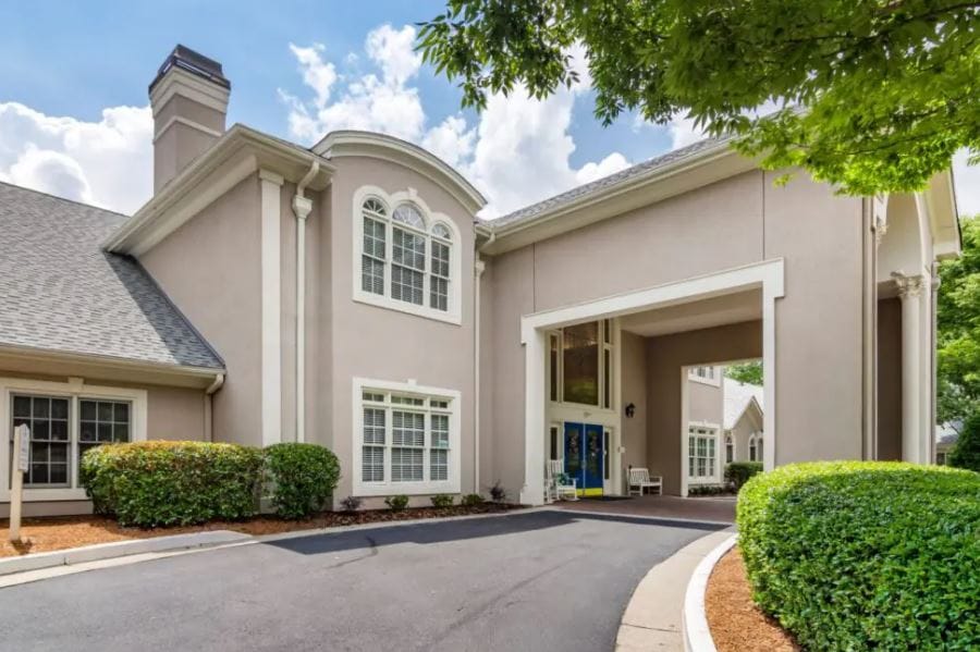 Building entrance with landscaped driveway