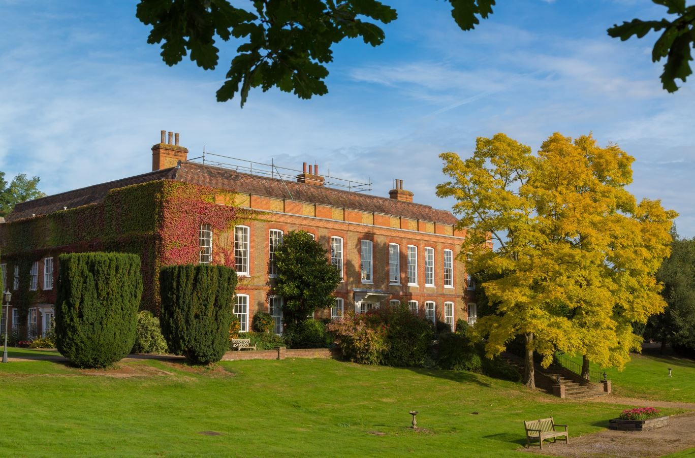 Exterior view of Frognal House Care Home with surrounding greenery