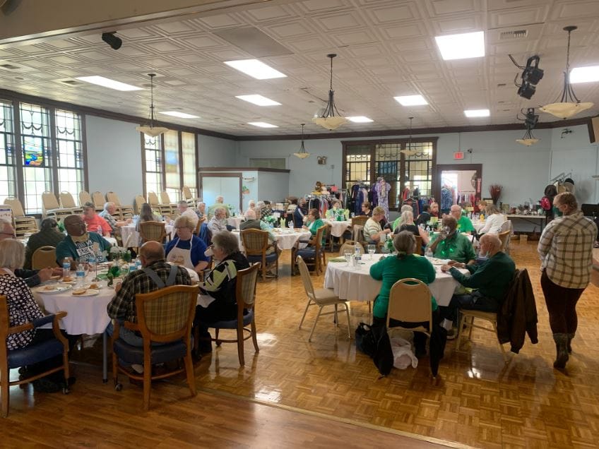 Residents enjoying a meal in a common dining area