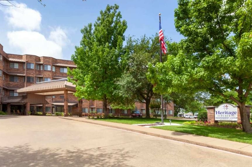 Exterior view of Heritage Place Independent Living with landscaping