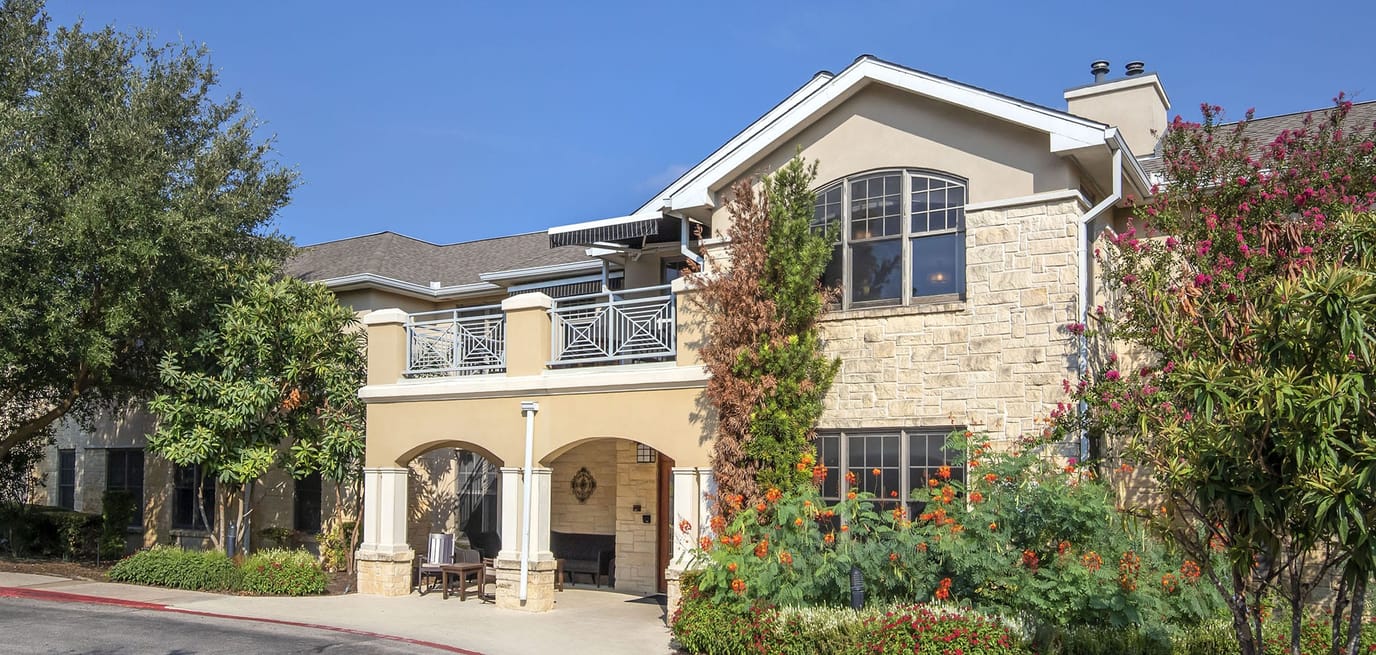 Exterior view of Brookdale Lakeway entrance with landscaping
