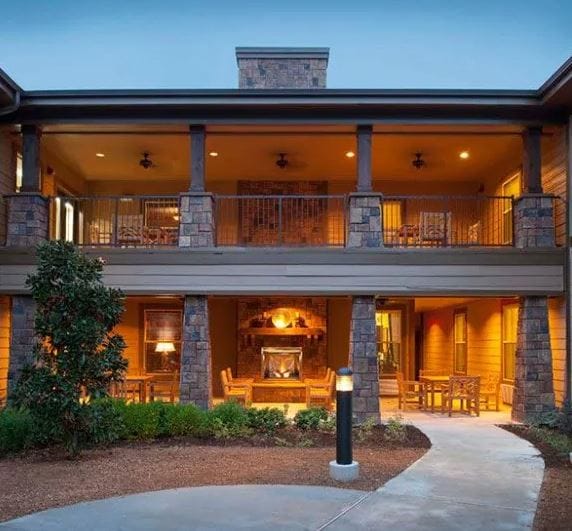 Exterior view of a senior living facility with a porch