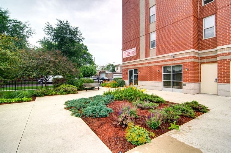 Outdoor garden area with walking paths and greenery