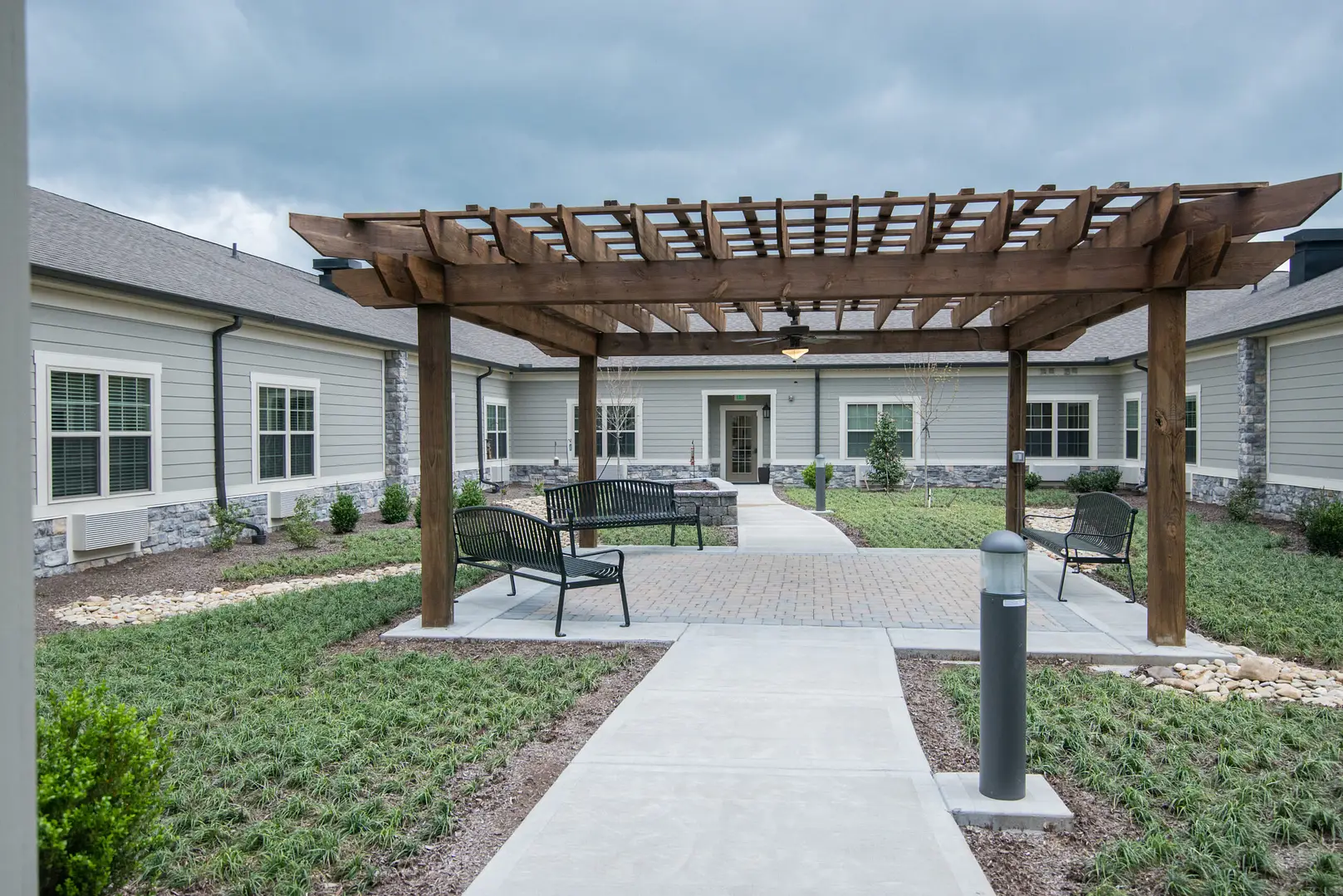 Outdoor courtyard space with seating and landscaping