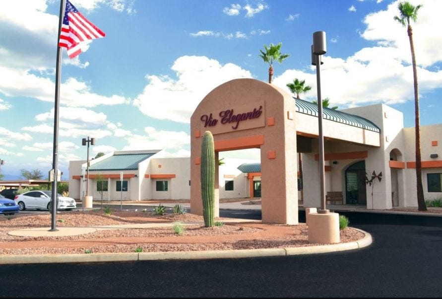Exterior view of Via Elegante facility with landscaping