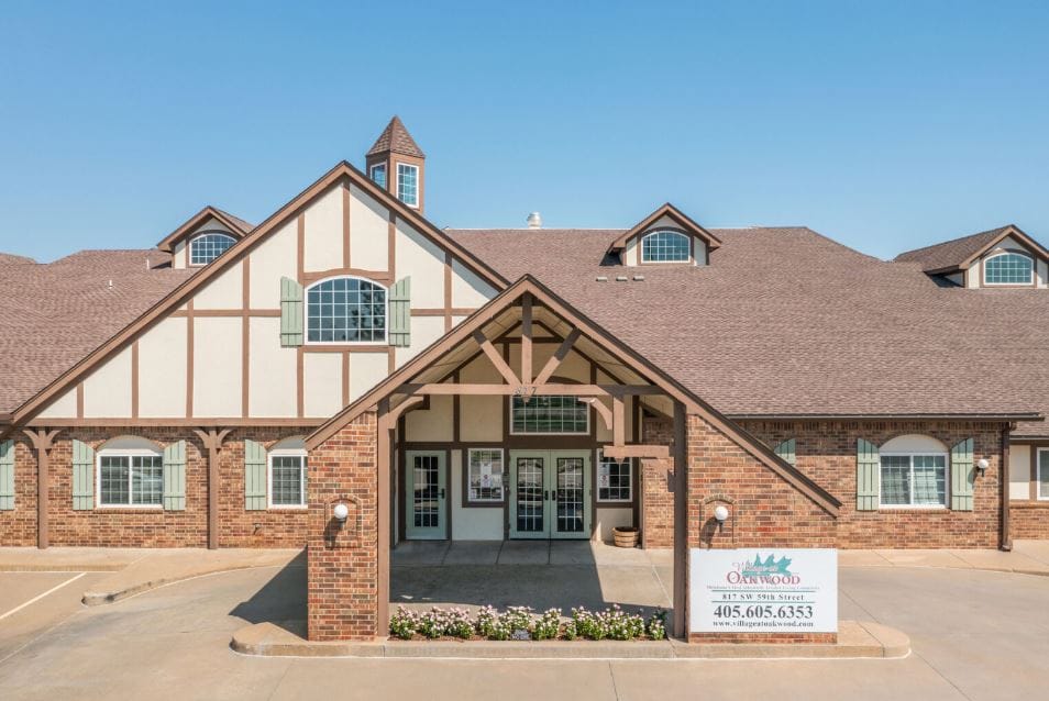 Exterior view of Village at Oakwood with signage