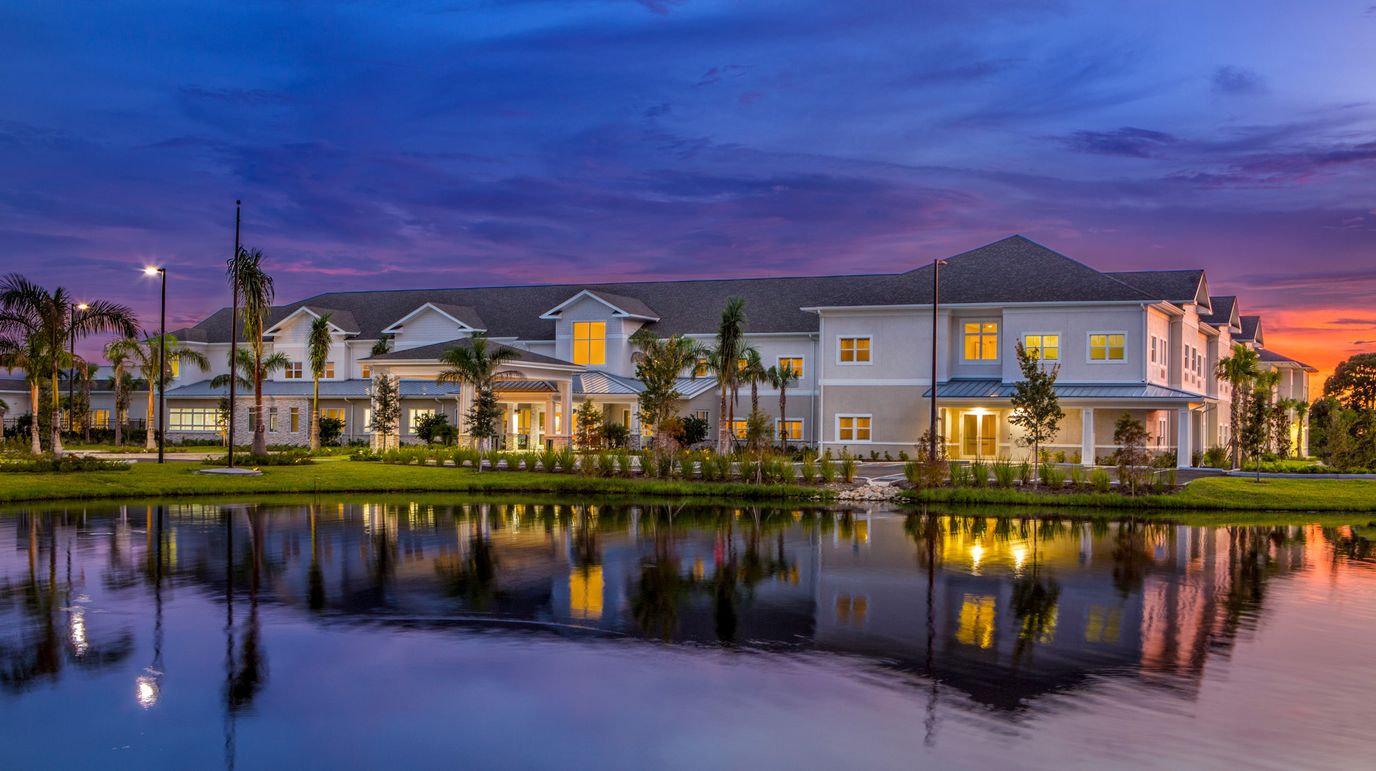 Exterior view of Heritage Oaks of Englewood at sunset