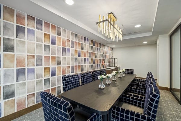 Bright interior common area with dining table and décor