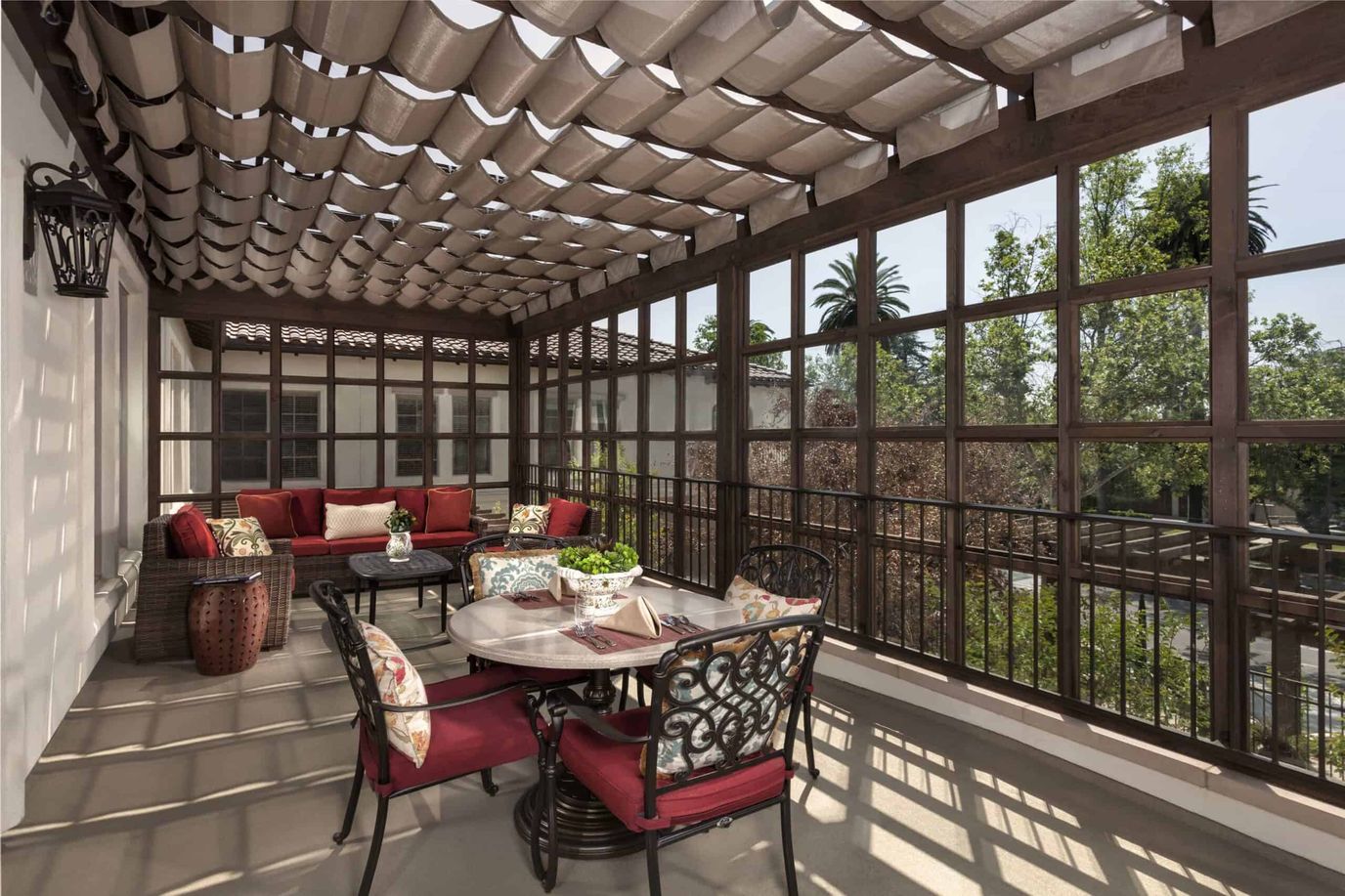 Outdoor patio area with seating and greenery