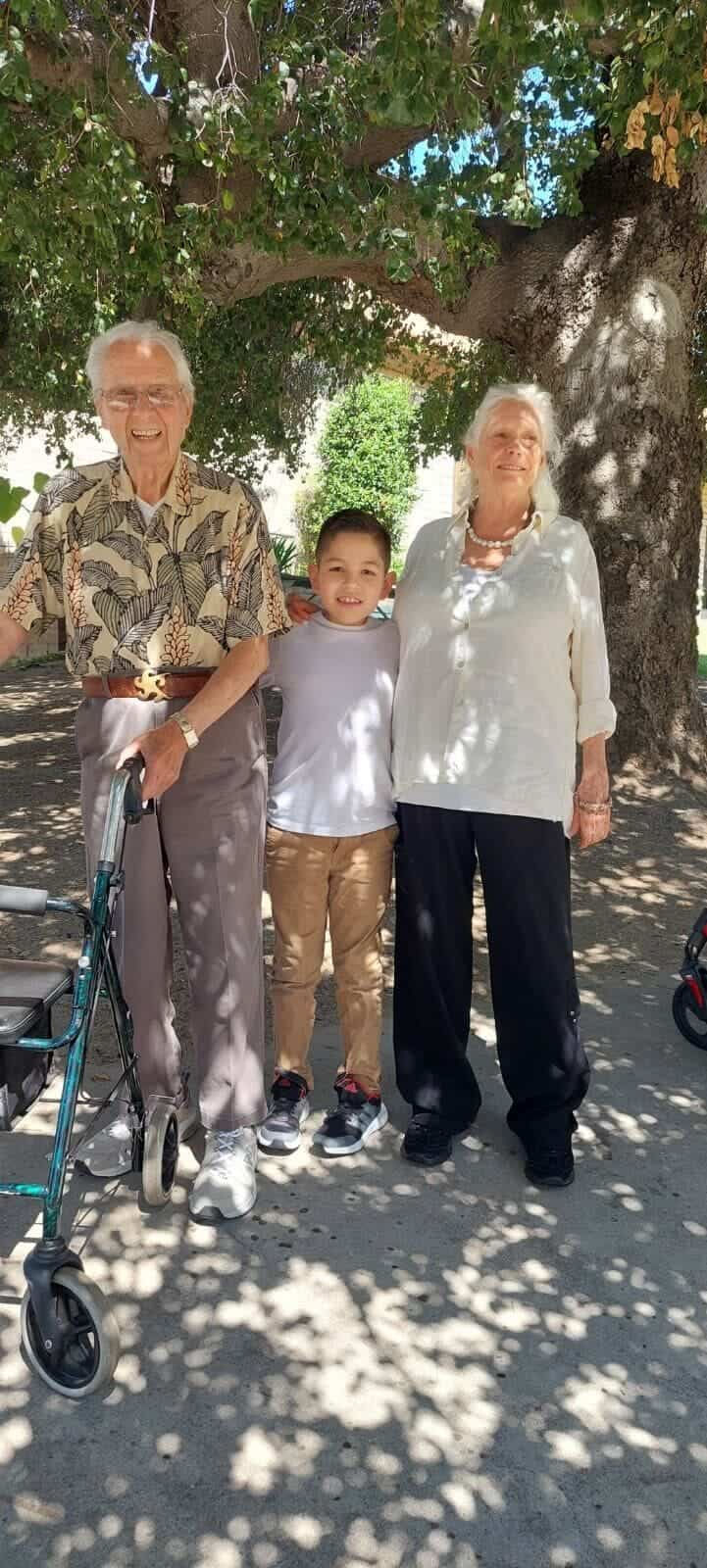 Residents enjoying time outdoors with a child