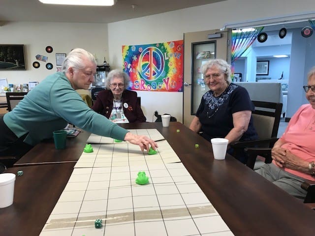 Residents engaging in a board game activity