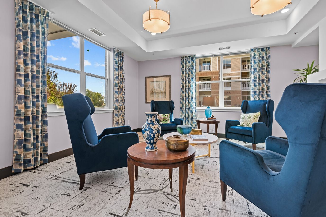 Cozy common area with chairs and decorative windows
