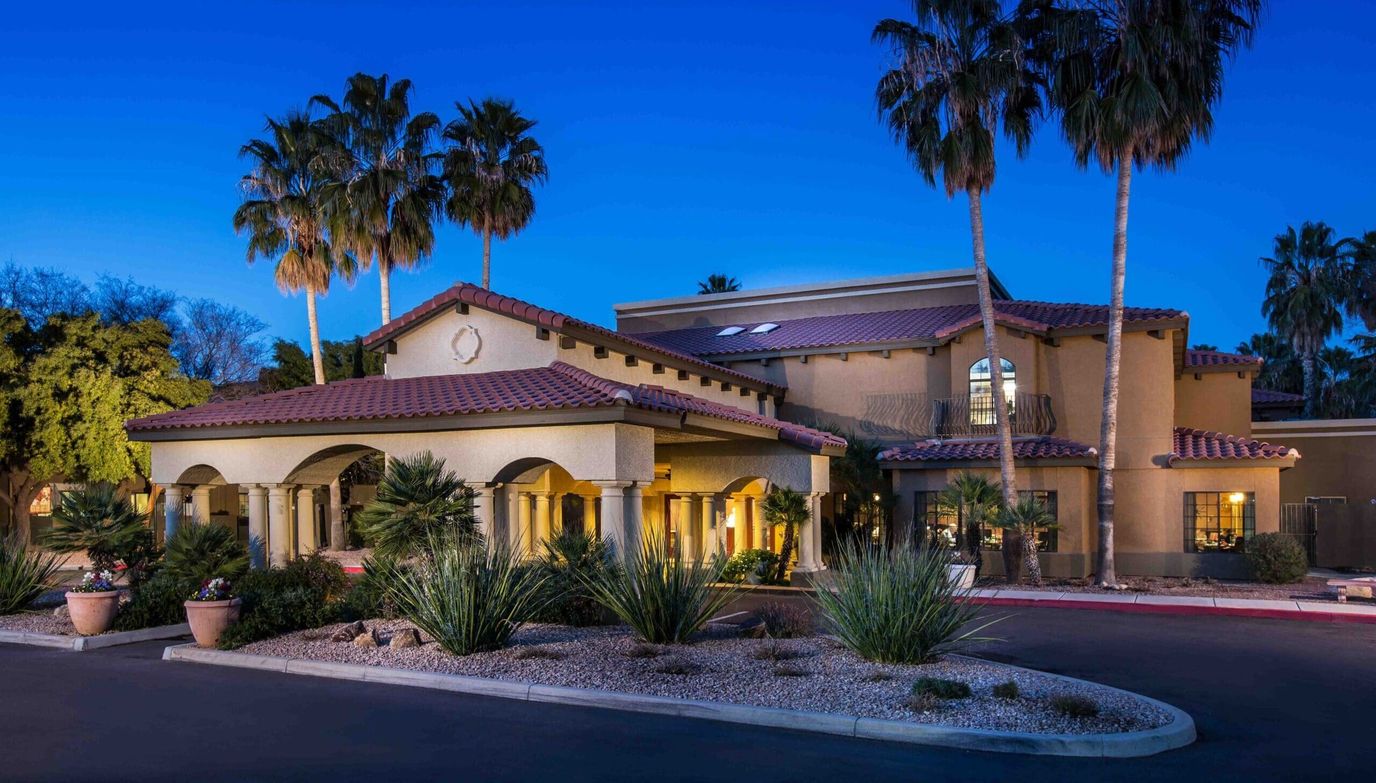 Exterior view of The Country Club of La Cholla at dusk