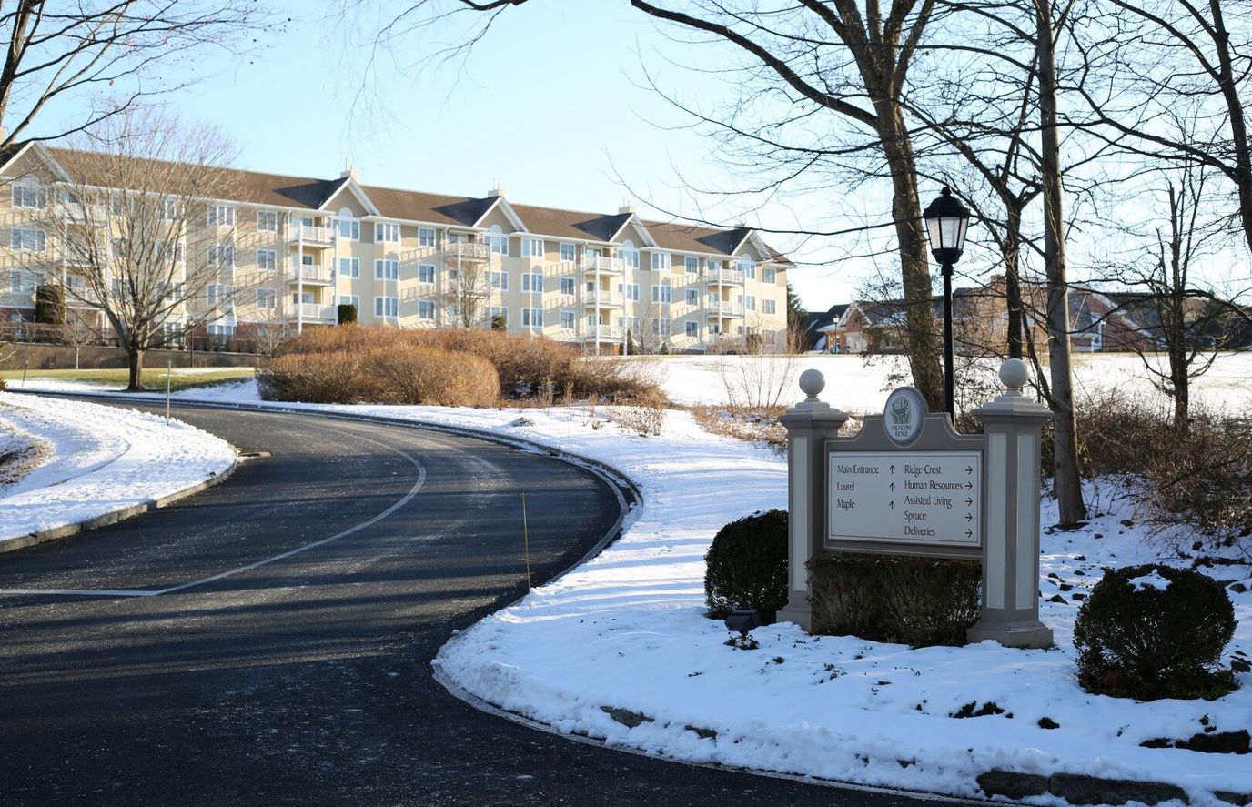Entrance sign leading to a senior living facility