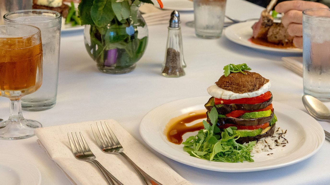Elegant plated meal at a dining room table