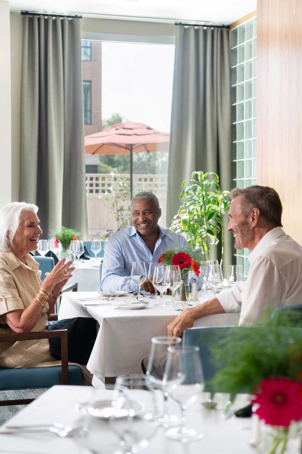 Residents enjoying a meal in the dining room