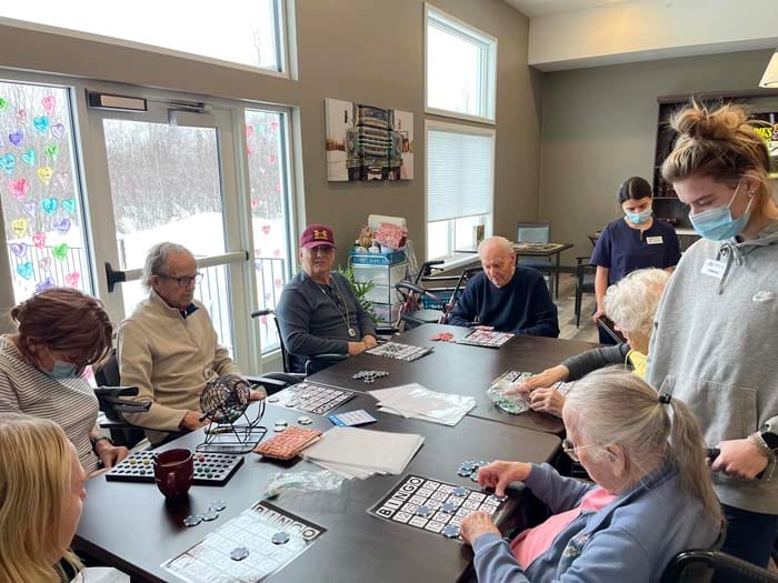 Residents playing bingo in a common area