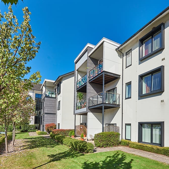 Exterior view of the retirement village building and gardens