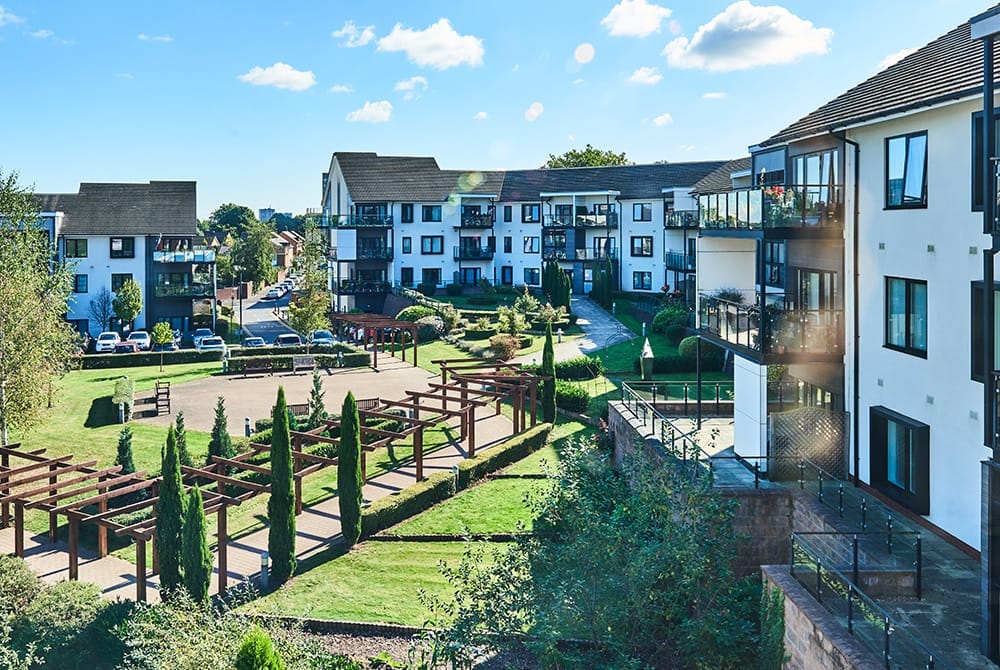 View of outdoor gardens and residential buildings