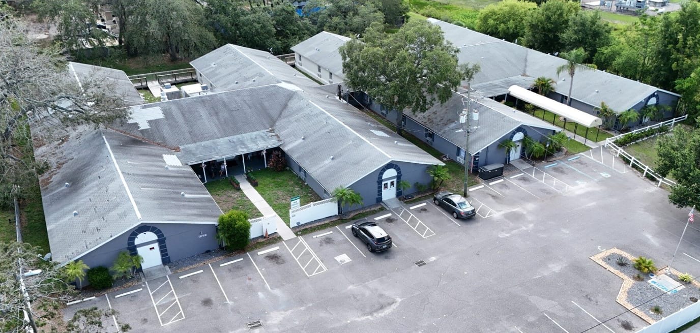 Aerial view of the Great American Assisted Living building and parking area