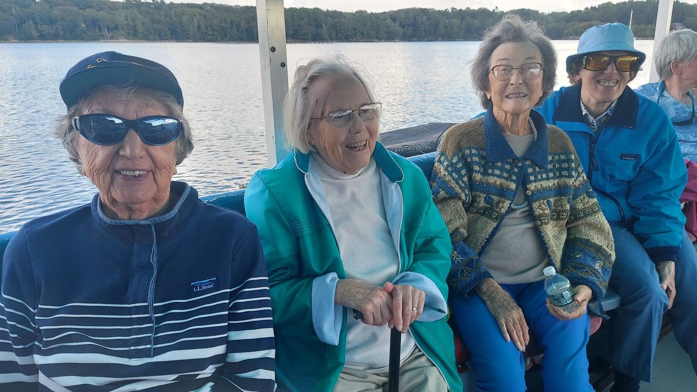 Seniors enjoying a boat ride together