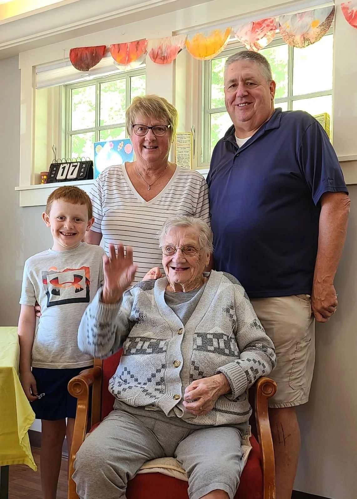 Family visits with a smiling resident