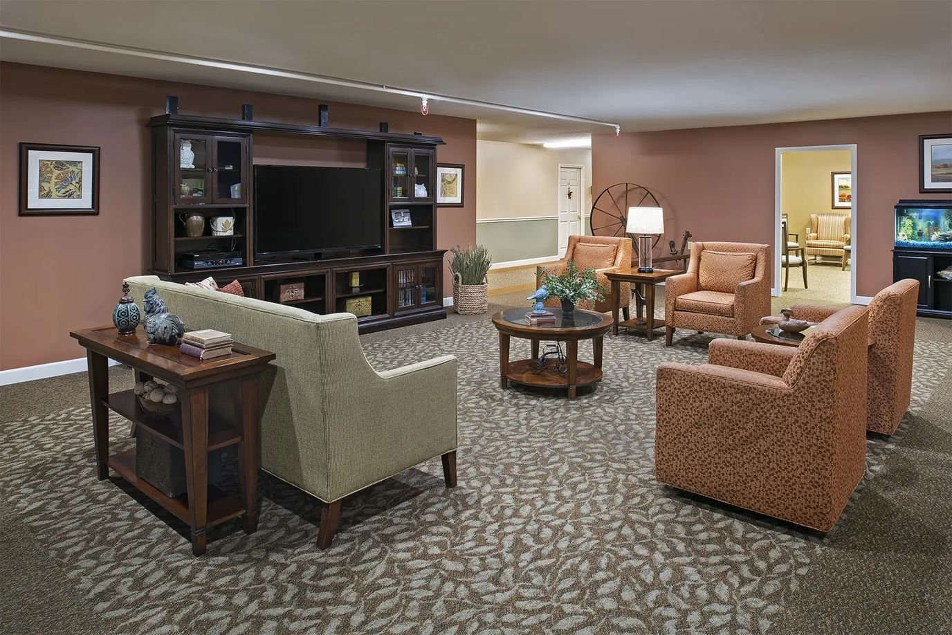 A cozy common area with seating and a television