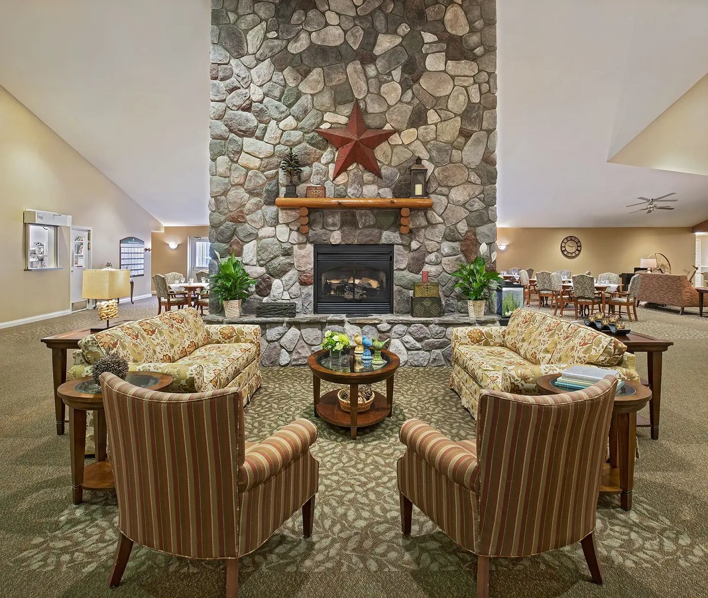 Cozy common area with stone fireplace and comfortable seating